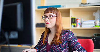 An office professional managing schedules at her computer