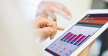 A close-up of a tablet with RCM information on the screen